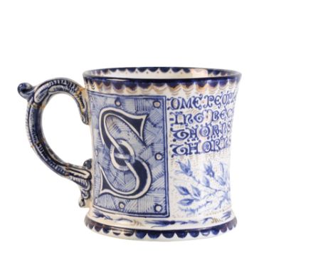 ARTS AND CRAFTS CERAMIC MUG, painted in blue and white and decorated with a frieze of roses and scrolling tendrils with gilt 