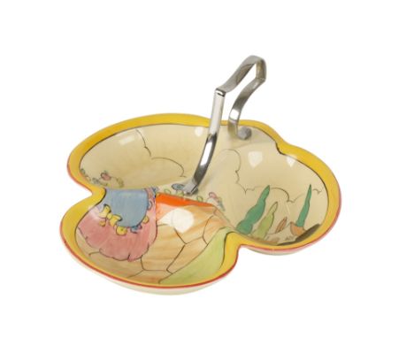 CLARICE CLIFF: AN "APPLIQUE IDYLL" DISH, trefoil form, scroll chrome plated carrying handle, painted in polychrome and decora