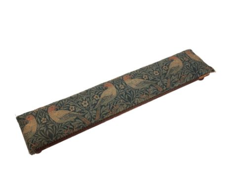 WILLIAM MORRIS FOR MORRIS & CO: A "BIRD" FABRIC UPHOLSTERED LOW STOOL, oblong form, raised on four bun feet, 122cm long x 24c