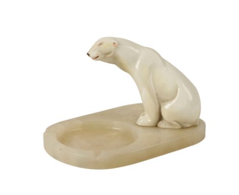 ART DECO POLAR BEAR ASHTRAY, the ceramic glazed model of the polar bear with painted features in a seated position, on a poli