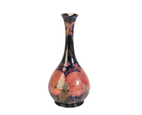 WILLIAM MOORCROFT: A "POMEGRANATE" VASE, baluster form with long slender neck, painted in polychrome, signed and impressed ma