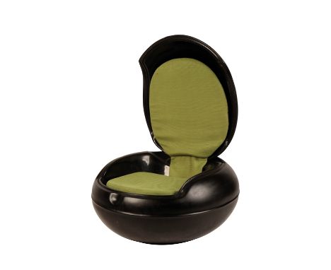 •PETER GHYCZY (b.1940): A BLACK POLYEURETHANE GARDEN EGG CHAIR, with hinged cover and original green fabric pads, 77cm deep x