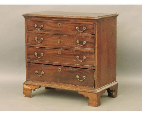 A George III mahogany small chest of four graduated long drawers, brass handles and shaped bracket feet, 77cm wide