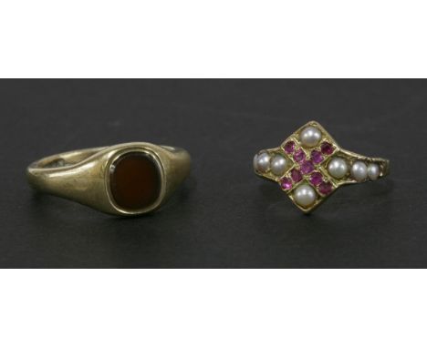 A gold ruby and split pearl ring, (shank damaged and later interior support plates to both shoulders, registration mark illeg