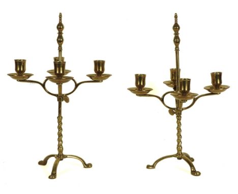 A pair of Dutch style adjustable four light candelabra, each on a tripod support, 38cm tall
