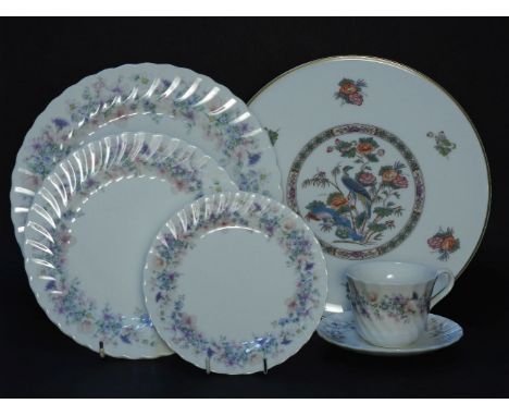 A Wedgwood Angela pattern dinner and tea service, decorated with pink and purple floral sprays