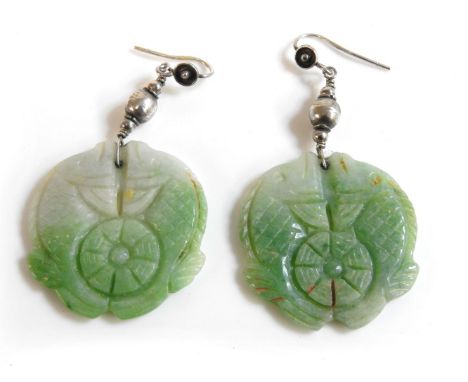A pair of jade carved earrings, in the form of Koi carp, in an unrelated Mikimoto box