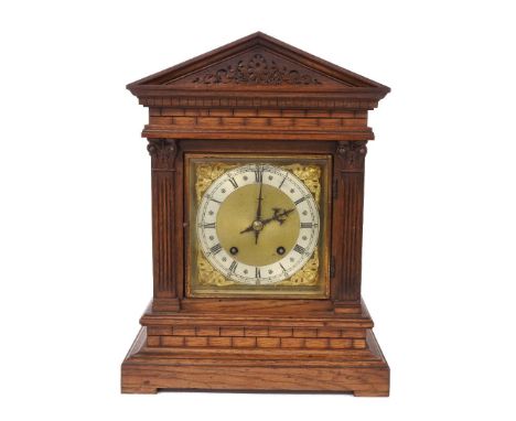 An oak cased mantle clock,  retailed by J.B. Benson, 41.5cm high