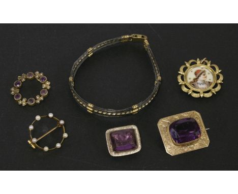 A rolled gold brooch with purple paste stone, a gold amethyst and split pearl circular brooch, a gold split pearl brooch, a g