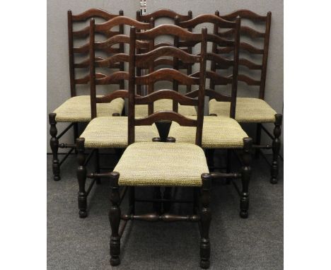 A set of six country made ladder back dining chairs, overstuffed upholstered seats, damaged