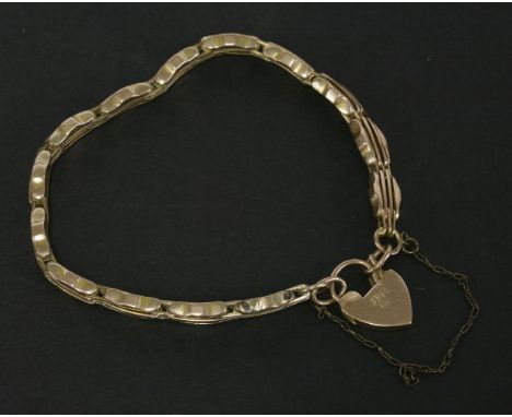 An Edwardian 9ct four row, bar gate link bracelet, with padlock, 6.48g