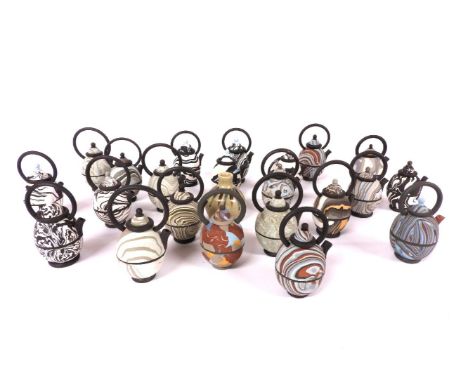 A collection of Roger Mitchell slip decorated egg shaped ewers, with high loop handles, inscribed 'Mitchell, 84' and a Leach 