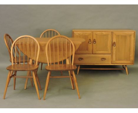 A light elm Ercol sideboard, together with Ercol drop leaf dining table and four chairs