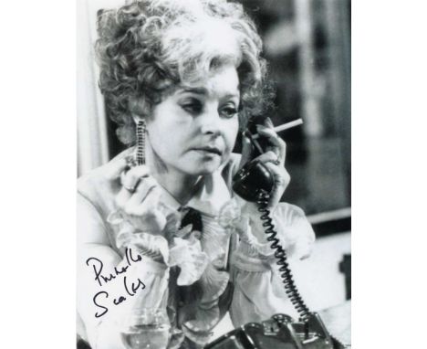 Prunella Scales signed 10 x 8 black and white photo. Classic shot of her as Sybil in Fawlty Towers. Good condition. All signe