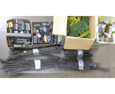 A collection of model railway wagons, a canal railway diorama and collection of diorama buildings, signals, track and trees *