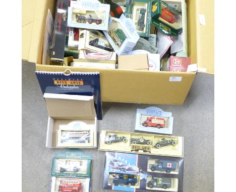 A box of Lledo model vehicles, Comedy Classics, The Spirit of Brooklands, Famous Stores of London, Dambusters 50th Anniversar