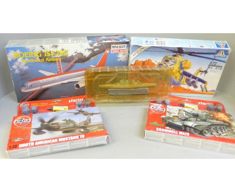 Two Airfix model plane kits; one Minicraft Boeing and a Italieri Soviet helicopter kit and a model Bismarck ship 