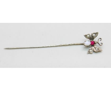 A butterfly stick pin set with opal, seed pearls and red stone 