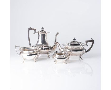 Comprising: a teapot, milk jug, two-handled sugar basin and a cream jug, the teapot with pierced rim and hinged cover, ebonis