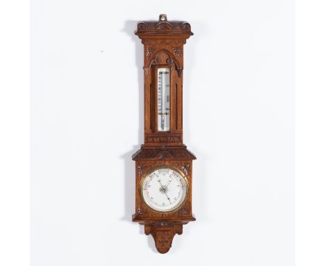 The circular white dial with calibrated outer ring, the case carved with floral spandrels, surmounted by a mercury Fahrenheit