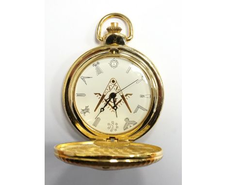 MASONIC HUNTER POCKET WATCHthe gilt brass case decorated with the compass and set square, the circular dial with Masonic symb
