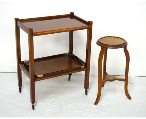 MAHOGANY TWO TIER TROLLEYwith moulded edge to both tiers, standing on four supports with castors, 62.5cm wide, a mahogany tra