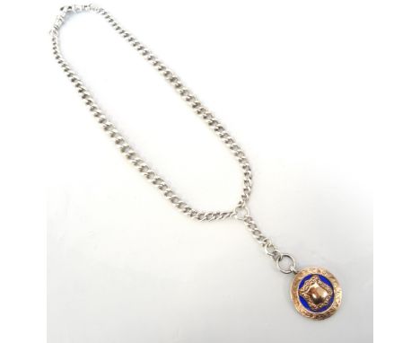 EDWARDIAN SILVER MEDAL with gold and enamel decoration, on a graduated silver double Albert chain 