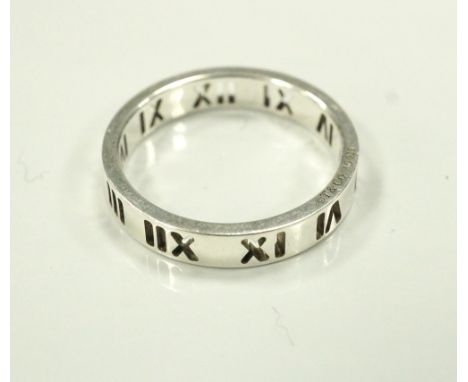 TIFFANY & CO SILVER ATLAS RINGwith pierced Roman numeral decoration, ring size M