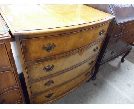 A reproduction walnut bow fronted chest of drawers 