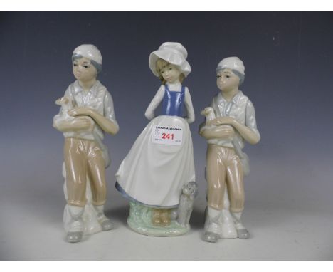 A Nao figurine of a girl and a puppy, together with two other figurines