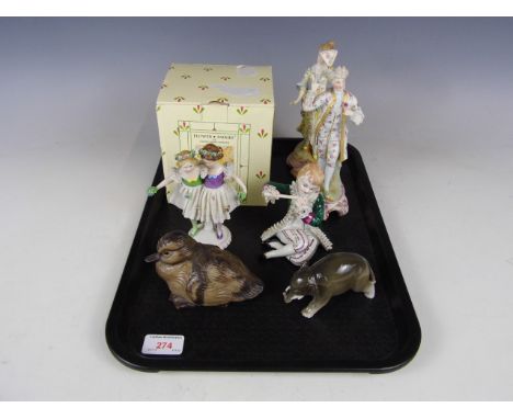 A pair of bisque figurines, a Poole Pottery duckling and a Border Fine Arts fairy etc.