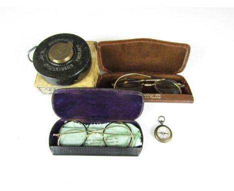 A Chesterman Bakelite measure, with fob compass and spectacles 