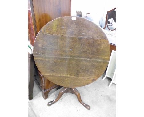 A circular mahogany tripod table (a/f)