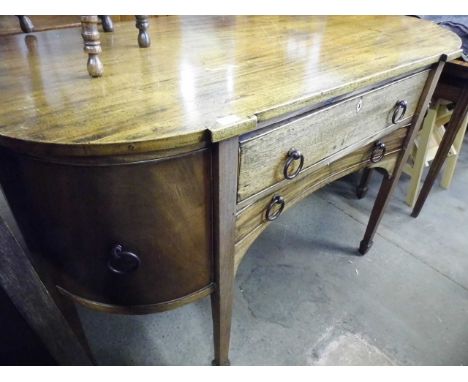 A George III bow fronted mahogany sideboard 