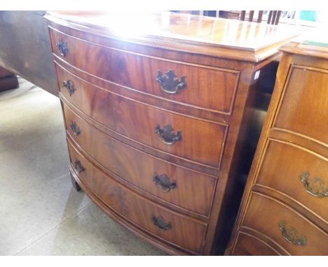 A reproduction mahogany bow fronted chest of drawers 