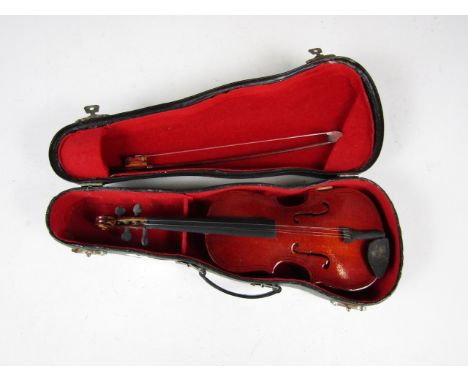 A small cased violin and bow