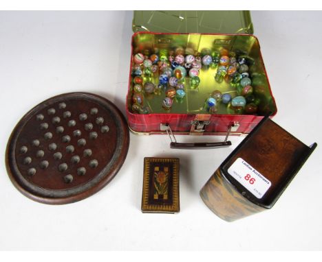 A solitaire board, marbles and playing cards etc. 