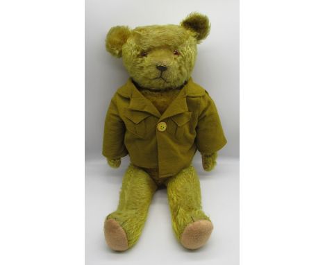 Circa 1920's American bear in golden mohair with glass eyes, jointed arms and legs, swivel head, stitched nose and mouth, wea