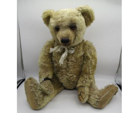 Farnell c. 1918/20 teddy bear in blonde mohair, with glass eyes, hump, elongated limbs, jointed arms and legs and swivel head