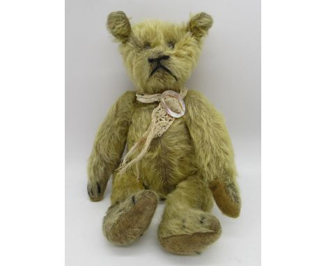 Circa 1915/20's early American small teddy bear, in blonde mohair, with boot button eyes, jointed arms and legs and swivel he