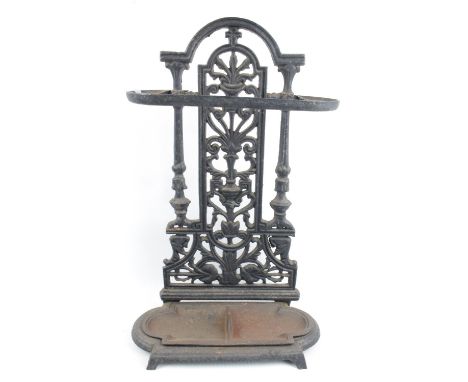 20thC Cast Iron Stick stand with removable drip tray under pierced foliate back