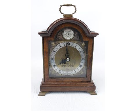 Good Quality Elliott of England Walnut cased clock, retailed for Bagshaws, supported on brass bracket feet 