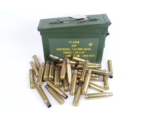 Ammunition Tin 7.62 Belt containing armourers vice, small brass grease gun, 2 compartment oil can, rifle oil bottle and 37 x 