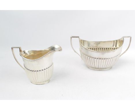 Matched Silver Sucrier and Creamer with fluted decoration Sheffield Silver, 329g total weight 