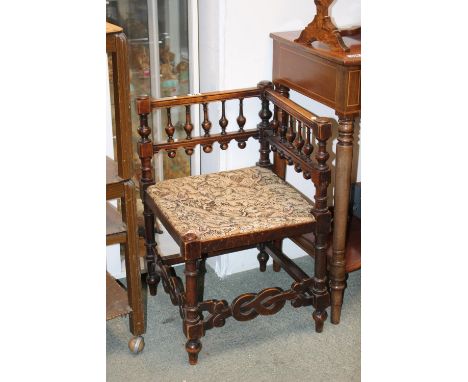 Oak Arts &amp; Crafts Bobbin turned corner chair with upholstered seat over scroll supports 
