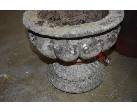 A cast concrete planter