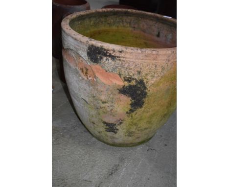 A large terracotta planter, weathered and a few chips, diameter approx. 52cm