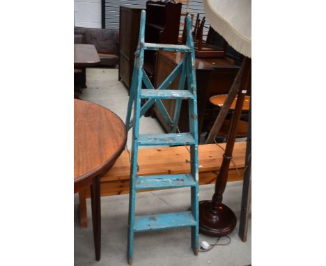 A set of vintage wooden step ladders
