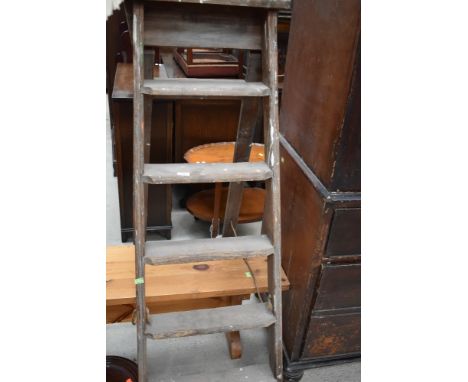 A set of vintage wooden step ladders