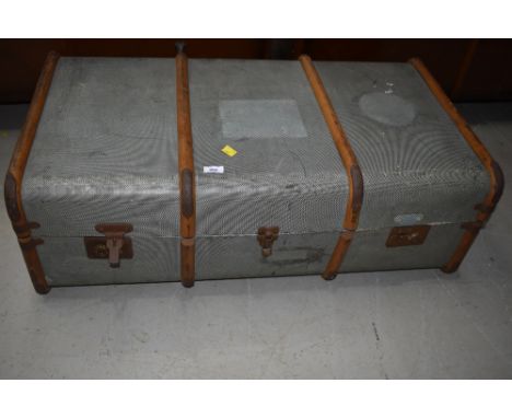 A vintage travel trunk , woodbound